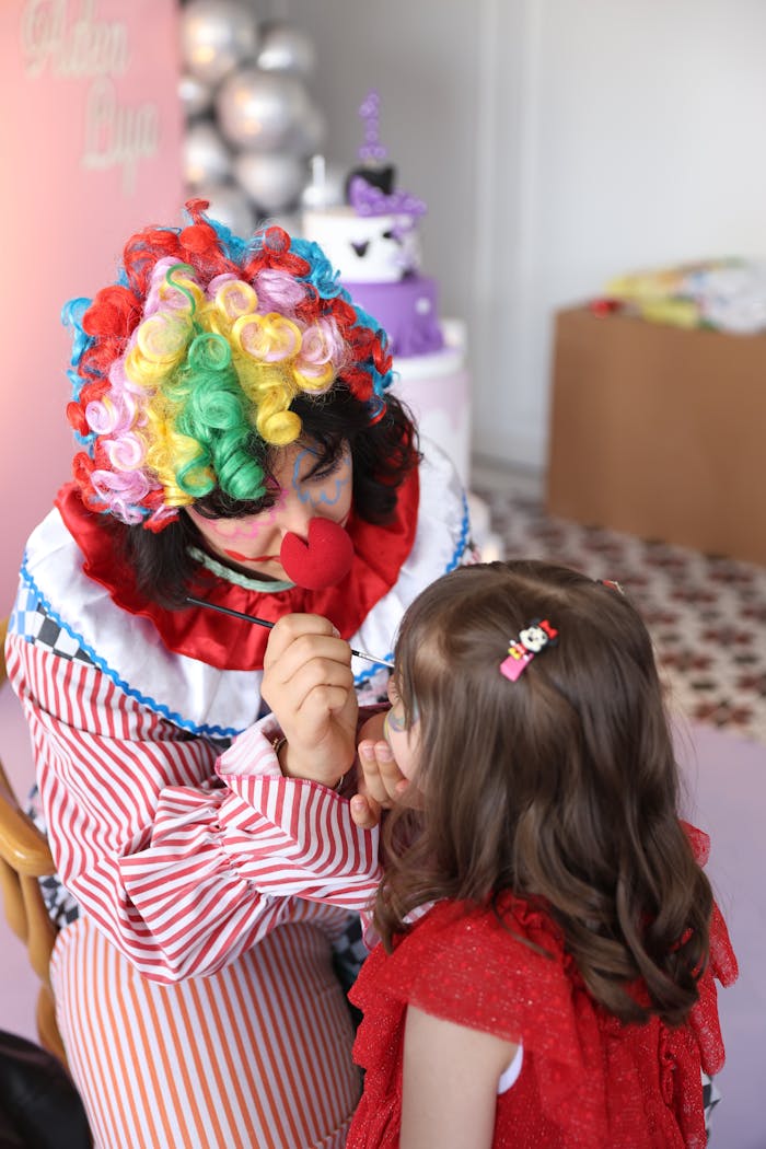 our-services-01 Clown face painting a girl at a lively children's party in Türkiye.